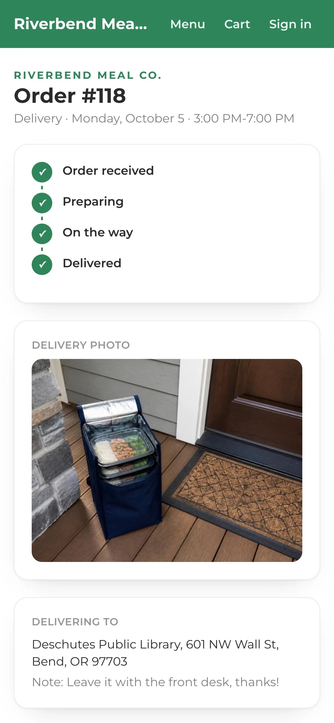 A customer's order tracking page: received, preparing, on the way with the driver's arrival time, delivered with a photo